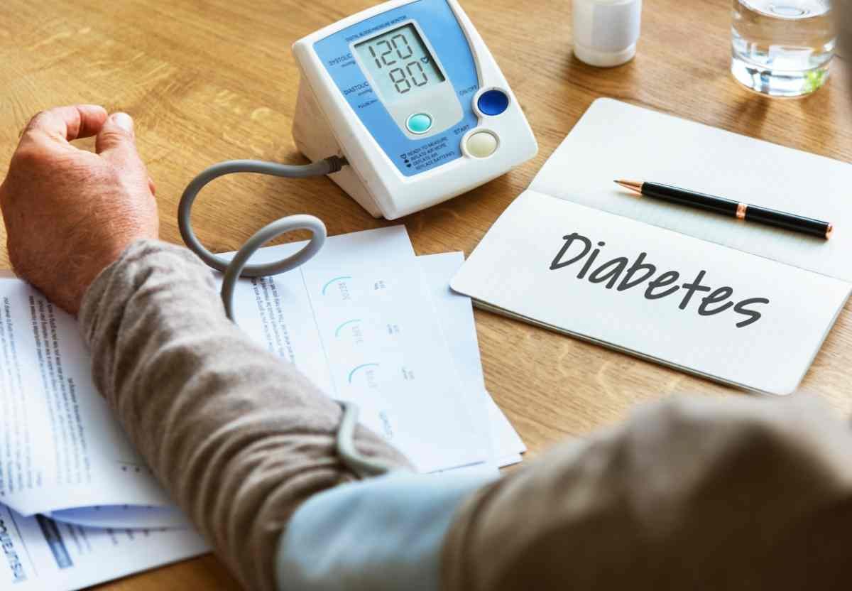 Doctor discussing diabetes monitoring and blood sugar management with a patient